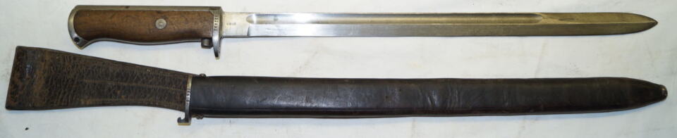 M1916 bayonet with full length blade and early M1894/12 LONG LEATHER scabbard and frog.