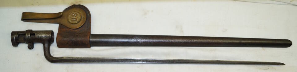 M1873 Triform socket bayonet with scabbard and brass hook.