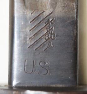 M1917 bayonet with leather tab scabbard.