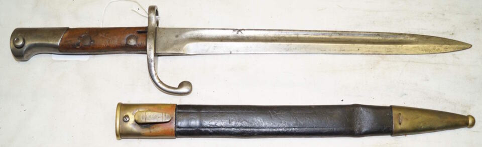 M1908 bayonet with brass bound leather scabbard.