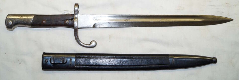 M1908 bayonet with steel bound leather scabbard.