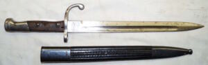 M1908 bayonet with steel bound leather scabbard.