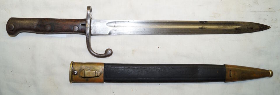 M1908 bayonet with brass bound leather scabbard.