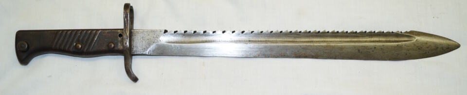 Rivetted hilt ersatz sawback bayonet.