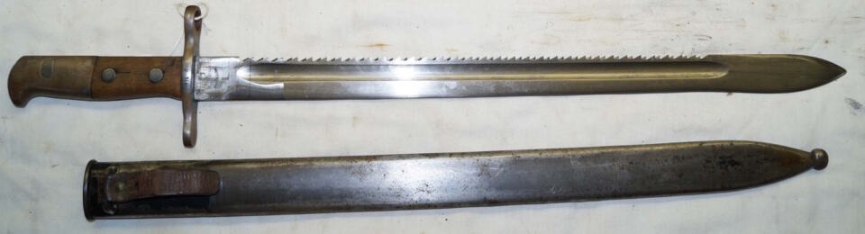 M1914 Pioneer sawback bayonet with scabbard.