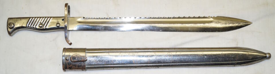 Rivetted hilt ersatz sawback bayonet with scabbard.