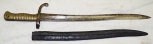 Comblain Cadet bayonet with leather scabbard remnant.