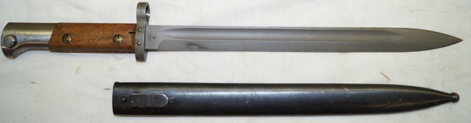 M937 bayonet with matching scabbard.
