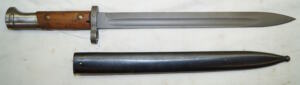 M937 bayonet with matching scabbard.