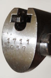 M937 bayonet with matching scabbard.