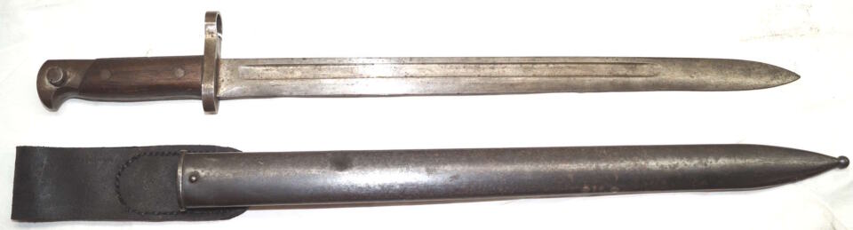 M1895 Winchester long bayonet with CORRECT scabbard with throatpiece retained with a rivet instead of a screw like the Remington scabbards.