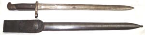 M1895 Winchester long bayonet with CORRECT scabbard with throatpiece retained with a rivet instead of a screw like the Remington scabbards.