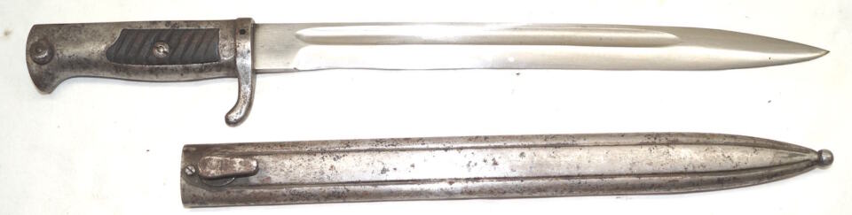 Ersatz bayonet with scabbard and wood grip inserts.