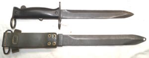 Mle.1958 bayonet with scabbard and green leather integral frog.