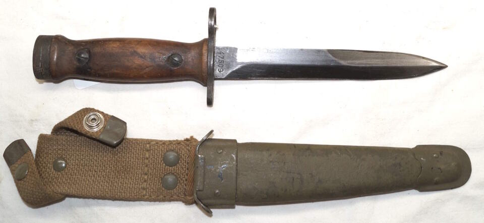Wood grip Italian M4 bayonet with leather scabbard.
