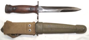 Wood grip Italian M4 bayonet with leather scabbard.