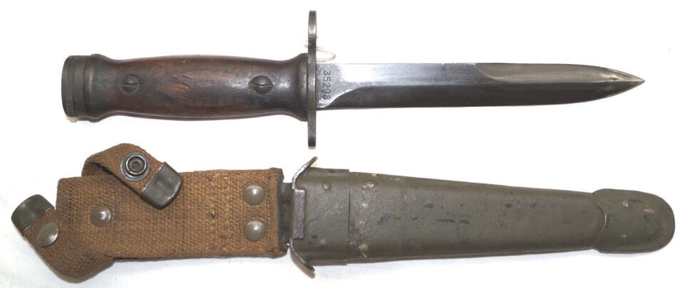 Italian produced M4 bayonet with Leather scabbard and wooden grips.
