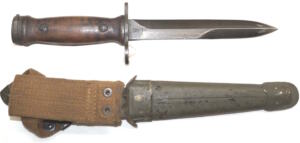 Italian produced M4 bayonet with Leather scabbard and wooden grips.
