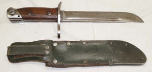 M1939 bayonet with green leather sheath.
