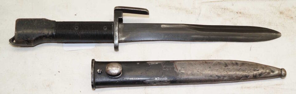 Type A FAL bayonet with scabbard .