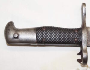 M1878 Vetterli sawback bayonet SJG NEUHAUSEN Grips cracked but remain tight.