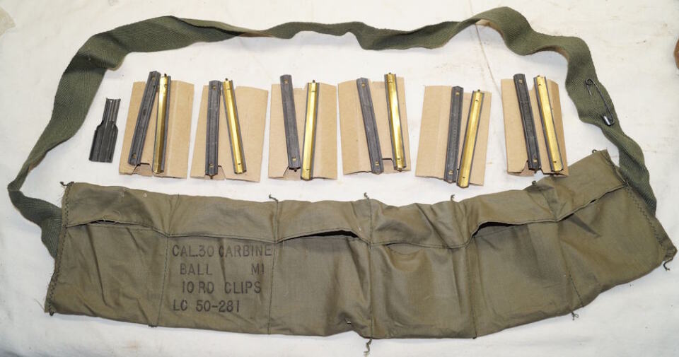US M1 Carbine ammunition bandoleers complete with speed loader, 6 cardboard inserts, 12 stripper clips and strap adjustment safety pin.